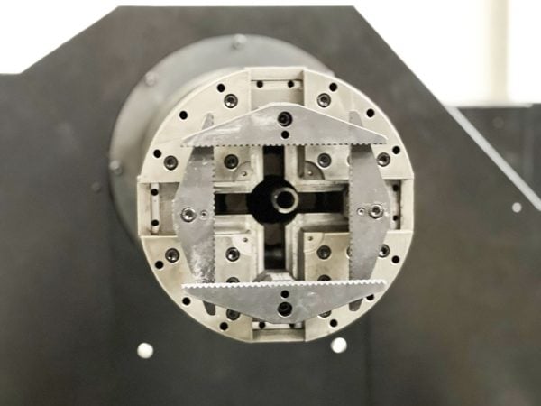 Tube laser cutter gripper closeup
