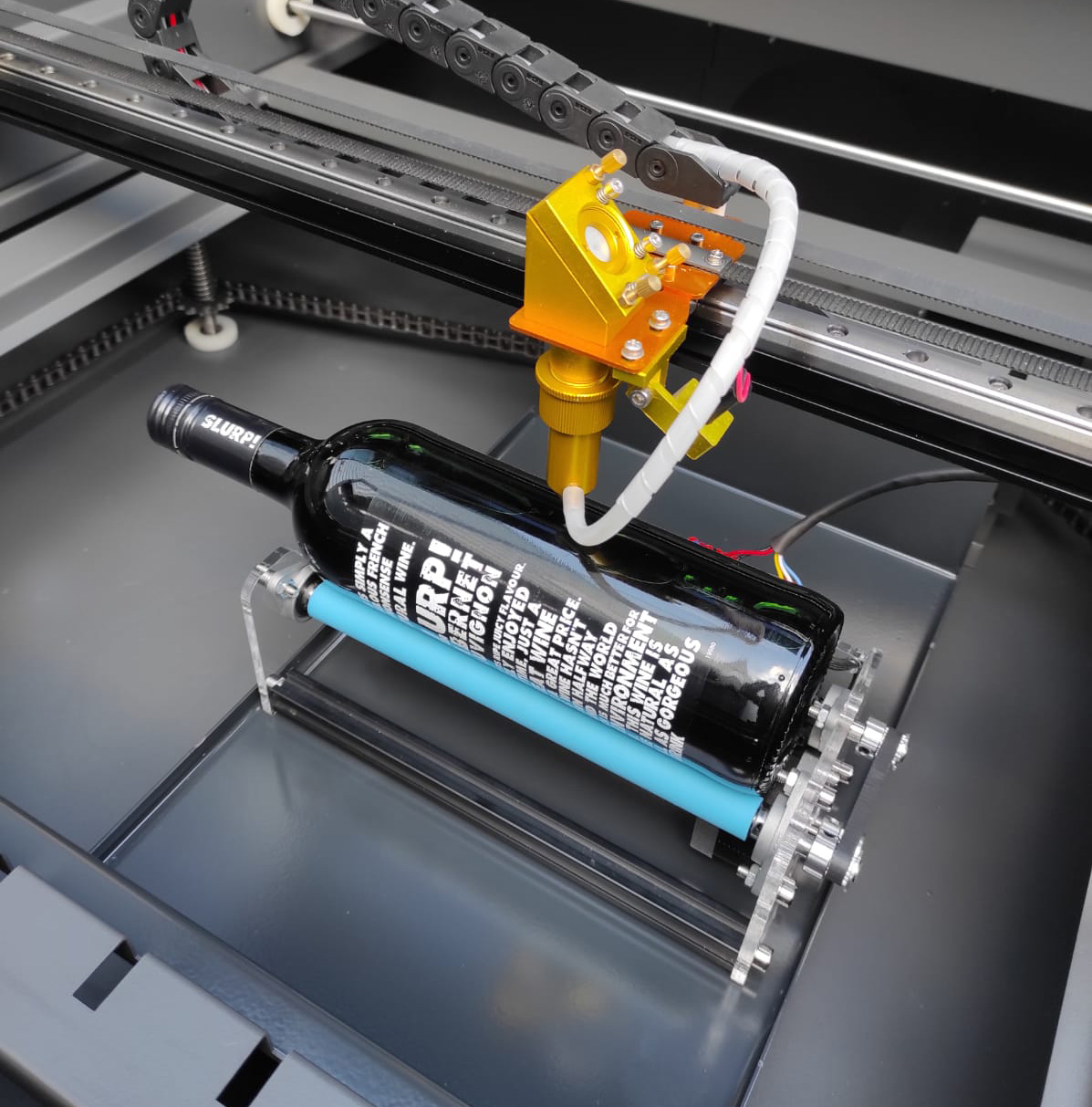 Laser engraving of round, cylindrical and conical objects - rotation module laser machine